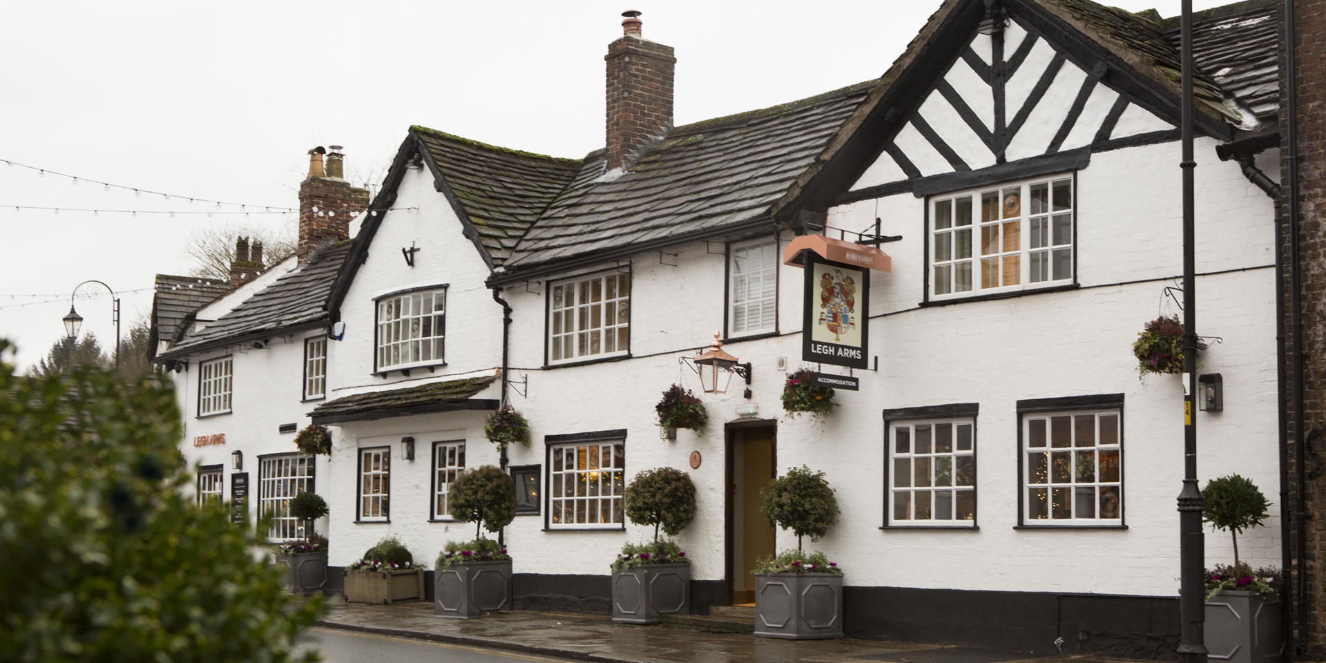 Outside the Legh Arms pub and hotel in Prestbury near Macclesfield and Alderley Edge